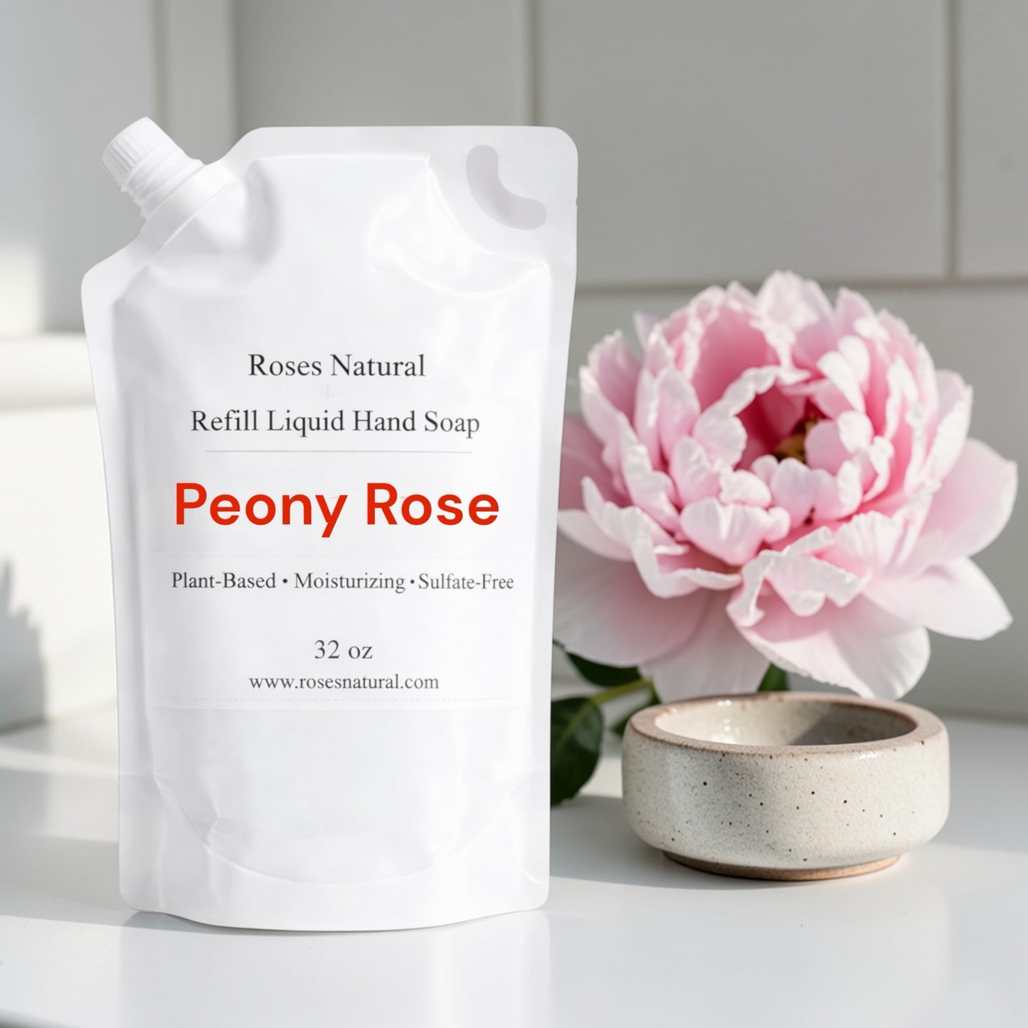 Peony Rose refill liquid hand soap with a pink flower and ceramic bowl on a white surface.