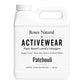 White laundry detergent container with 'Roses Natural' branding on a white background Activewear Patchouli