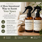 Two brown spray bottles with black nozzles on a wooden surface, surrounded by sandalwood and sandalwood essential oil, with text about the product's features.