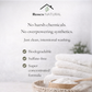 Stack of white towels with 'Roses Natural' branding and product benefits listed.