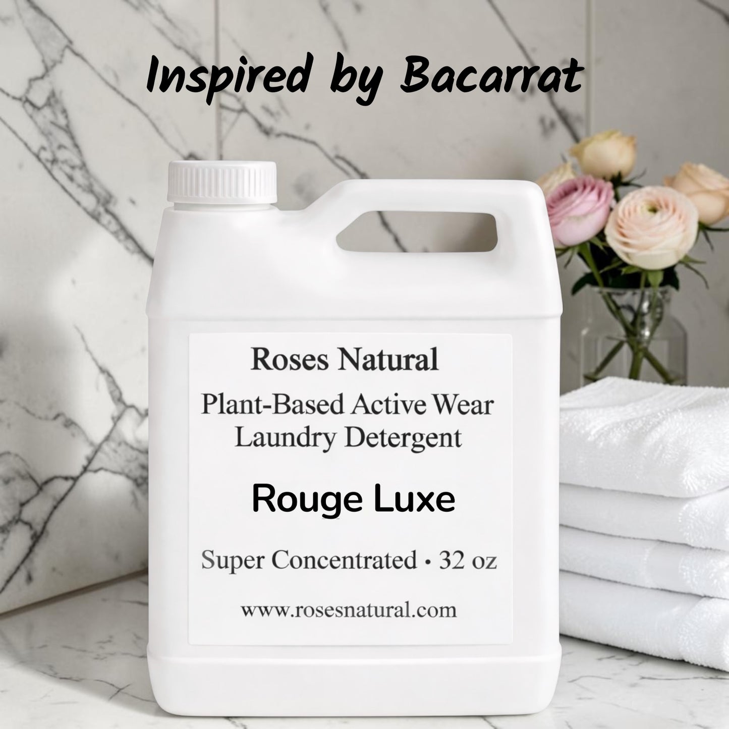 Jug of Roses Natural Plant-Based Active Wear Laundry Detergent on a marble surface with flowers in the background. Rouge Luxe scent 