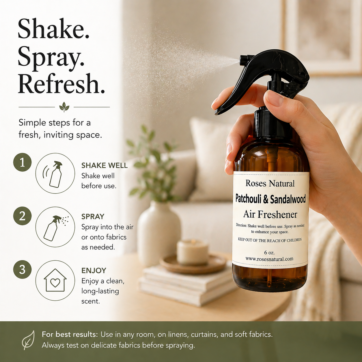 Hand holding a bottle of Roses Natural air freshener with usage instructions in a living room setting.