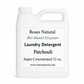 White laundry detergent container with text on a white background Patchouli Scent
