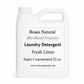 White laundry detergent container with text on a white background Fresh Linen Scent