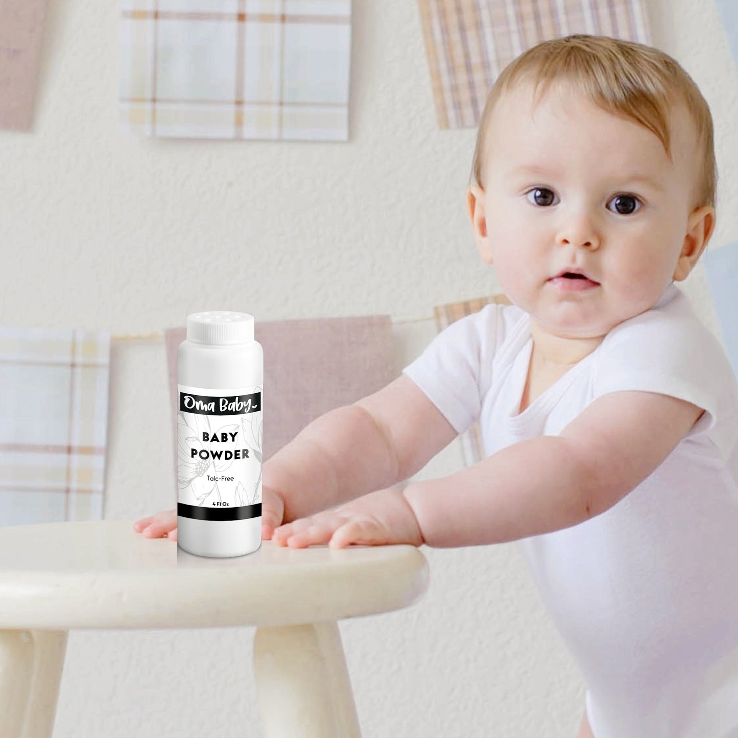 Baby holding a bottle of baby powder with a plaid background