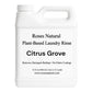 White bottle of Roses Natural Plant-Based Laundry Rinse with 'Citrus Grove' scent on a white background