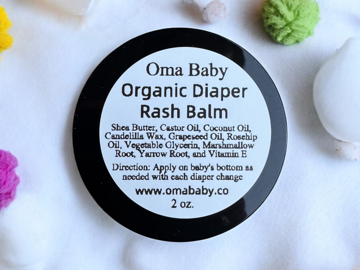 Oma Baby Organic Diaper Rash Balm container with label on a white background
