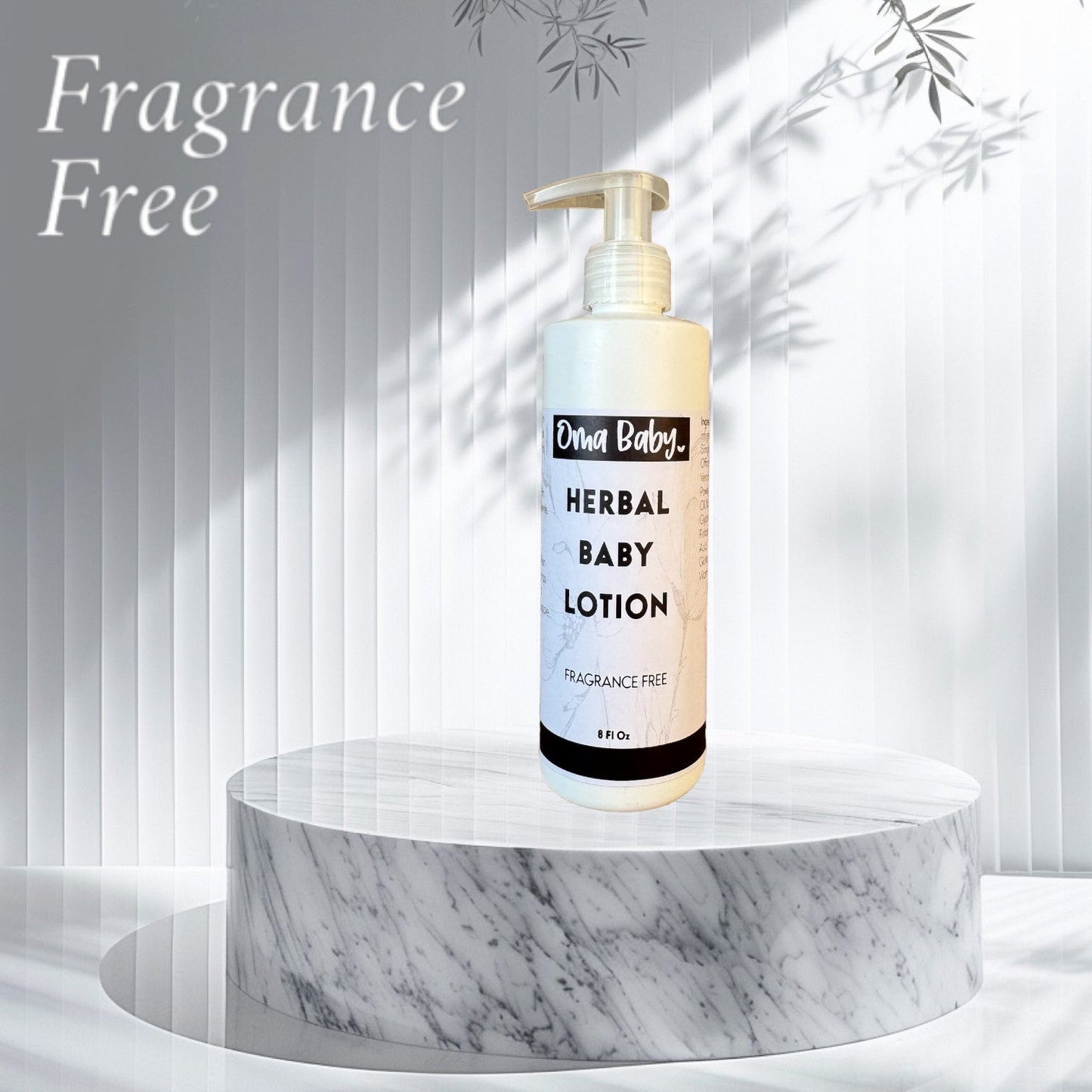 Olive Baby Herbal Baby Lotion bottle on a marble pedestal with a light gray background