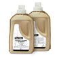 Two bottles of oma baby natural laundry detergent on a white background